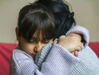 Child hugging mother