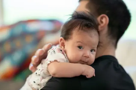 Father holding baby
