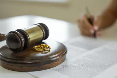 Wedding rings on top of a gavel