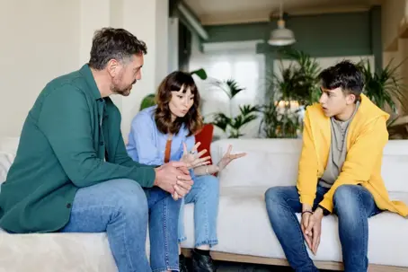Parents having a discussion with teenage son