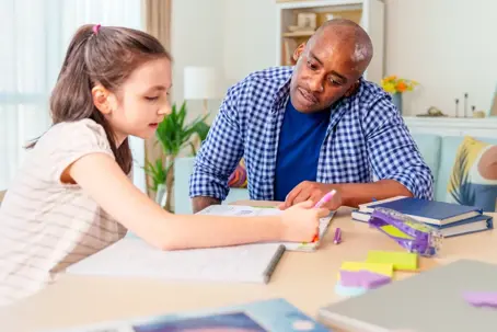 Parent helping child with homework