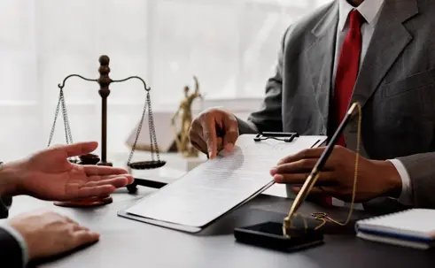Lawyer showing client documents