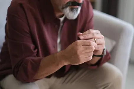Man touching his wedding ring