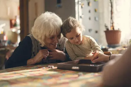 Grandma playing with her granddaughter