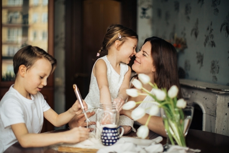 mother with two children at table