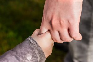 Holding child hand