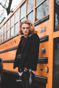 Man standing at the side of the bus