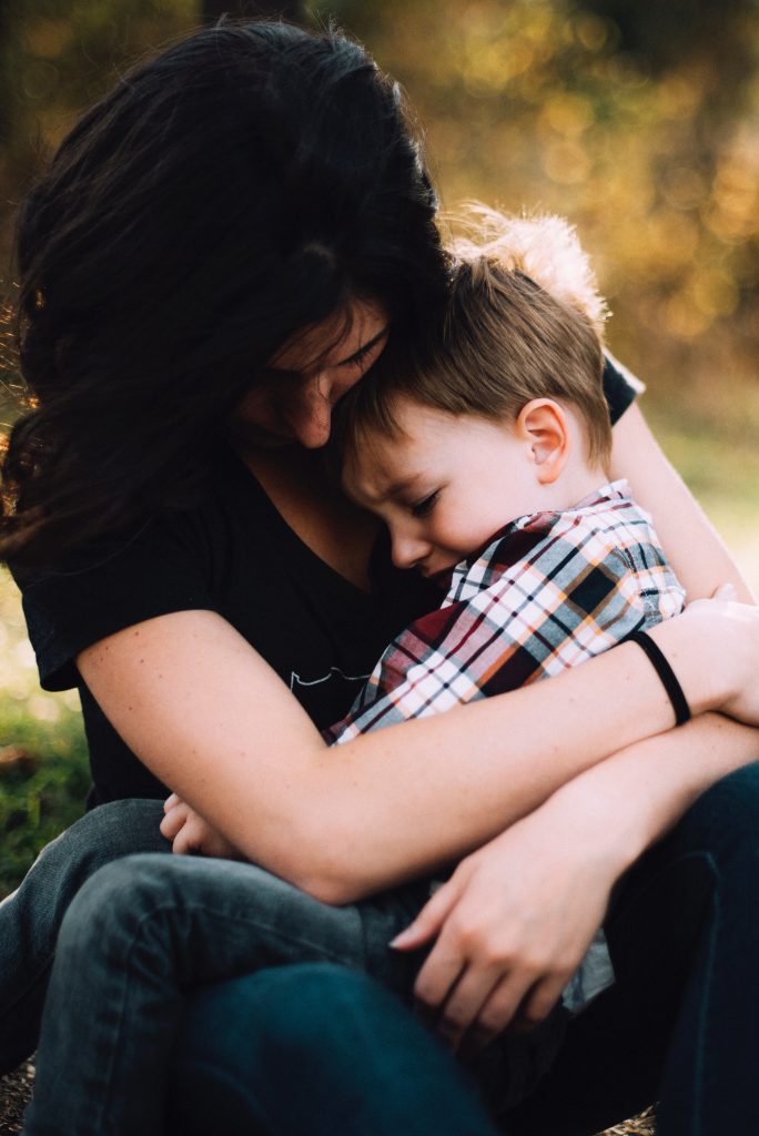 Mother hugging her son