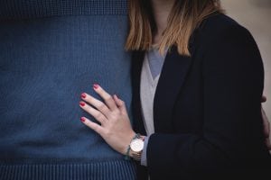 Woman's hand holding his man