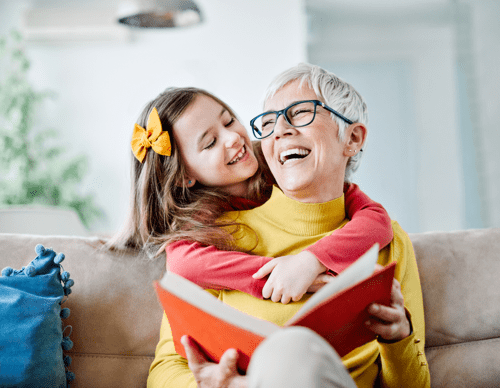 Grandmother and Granddaughter laughing together